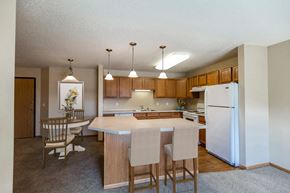 Bismarck apartment for rent - Kitchen with Wood Cabinetry at Sunset Ridge Apartments in Bismarck, ND