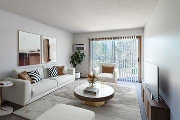 Eagan apartment for rent - a living room with a white couch and a coffee table