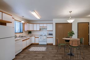 West Fargo apartment for rent - a kitchen and dining room with a table and chairs. Fargo, ND Eagle Run Apartments