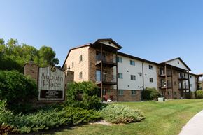 Fargo apartment for rent - Exterior of a three level apartment with a sign outside. Fargo, ND Auburn Apartments .