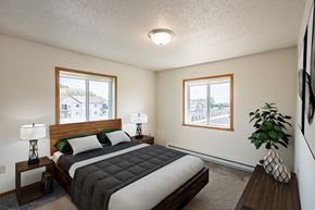 Fargo apartment for rent - Fargo, ND Bayview Apartments. A bedroom with a bed and two windows