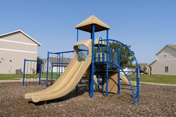Fargo townhouse for rent - a playground with a slide and a tower