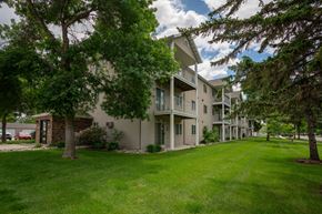Fargo apartment for rent - our apartments have a spacious yard with green grass and trees