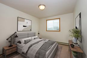 Fargo apartment for rent - Fargo, ND Cambridge Apartments a bedroom with a large bed and a window