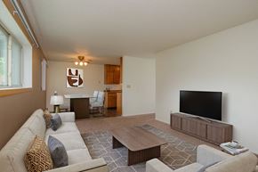 Fargo apartment for rent - a living room with a couch and a television. Fargo, ND Country Club Apartments