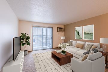 Fargo apartment for rent - a living room with a white couch and a tv