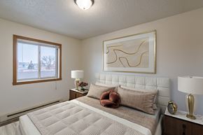 Fargo apartment for rent - a bedroom with a bed and a window. Fargo, ND Crescent Park Apartments