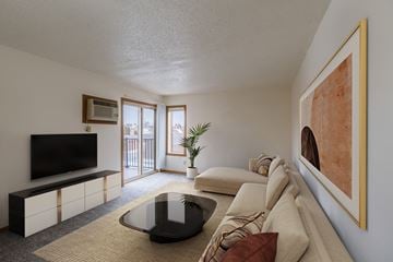 Fargo apartment for rent - a living room with a couch and a coffee table and a tv