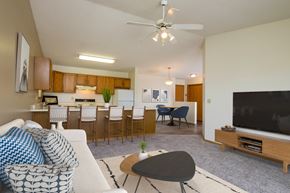 Fargo apartment for rent - Fargo, ND Flickertail Apartments a living room with a couch and a table in front of a tv