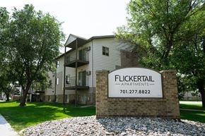 Fargo apartment for rent - Fargo, ND Flickertail Apartments. Exterior of an apartment building with a sign that says Flickertail outside.