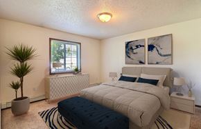 West Fargo townhouse for rent - Fargo, ND Foxboro Townhomes. a bedroom with a large bed and a window