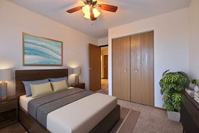 Fargo apartment for rent - a bedroom with a bed and a ceiling fan at France, Fargo North Dakota