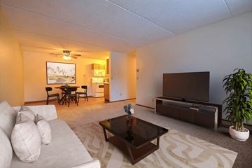 Fargo apartment for rent - a living room filled with furniture and a flat screen tv. Fargo, ND France Apartments