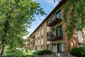 Fargo apartment for rent - Exterior view of a brick apartment building with balconies. Fargo, ND Granger Court Apartments.