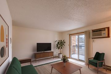 Fargo apartment for rent - a living room with a couch and a table and a tv