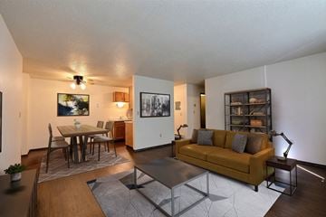 Fargo apartment for rent - a living room and dining room with a couch and a table