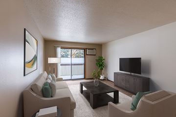 Fargo apartment for rent - a living room with a couch and a coffee table and a tv