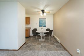 Fargo apartment for rent - a dining area with a table and chairs. Fargo, ND Maplewood Bend Apartments