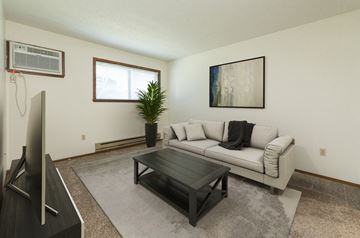 Fargo apartment for rent - the living room of an apartment with a couch and a coffee table