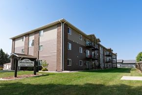 Fargo apartment for rent - a large apartment building with a sign in front of it. Fargo, ND Maybrook Apartments