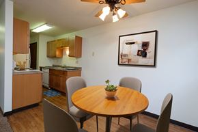 Fargo apartment for rent - Fargo, ND Monticello. A dining area with a table and chairs and a kitchen in the background