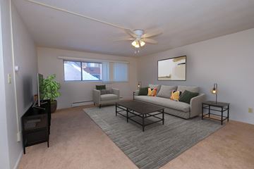 Fargo apartment for rent - a living room with a couch and a coffee table