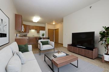 Fargo apartment for rent - a living room with a couch and a coffee table