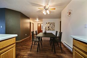 Fargo apartment for rent - A dining room with a table and chairs. Fargo, ND Oxford Apartments.