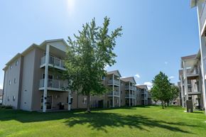 West Fargo apartment for rent - Fargo, ND Parkside Apartments. An exterior view of an apartment complex