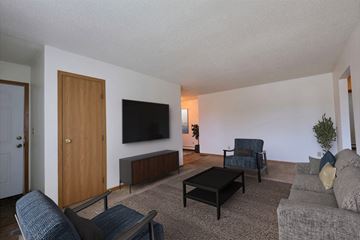 West Fargo apartment for rent - a living room with a couch and a tv