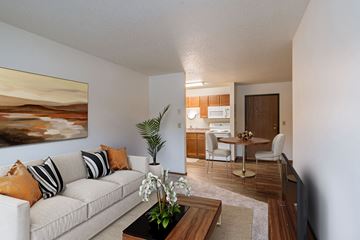 Fargo apartment for rent - a living room and dining room with a couch and a table