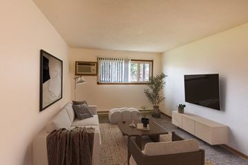 Fargo apartment for rent - a living room with a couch and a tv