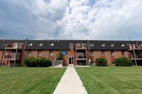 Fargo apartment for rent - Fargo, ND Patricia Ann Apartments. A pathway leading to a brick building with balconies