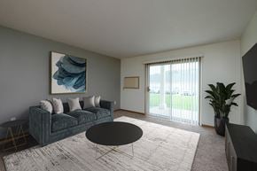 Fargo apartment for rent - A living room with a couch and a coffee table. Fargo, ND Pinehurst Apartments.