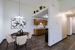 Fargo apartment for rent - an open kitchen and dining room with a table and chairs. Fargo, ND Place One Apartments