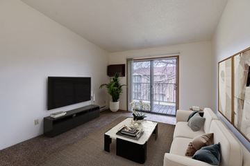 Fargo apartment for rent - a living room with a couch and a coffee table and a television
