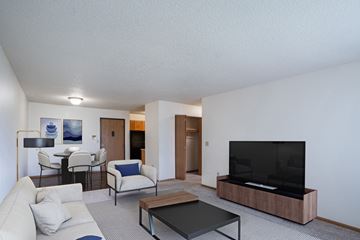 West Fargo apartment for rent - a living room with a couch and a coffee table and a television