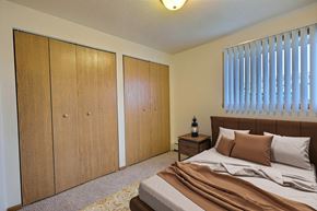 West Fargo apartment for rent - Fargo, ND Saddlebrook Apartments. a bedroom with a bed and two closets