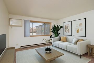 Fargo apartment for rent - a living room with a couch and a coffee table