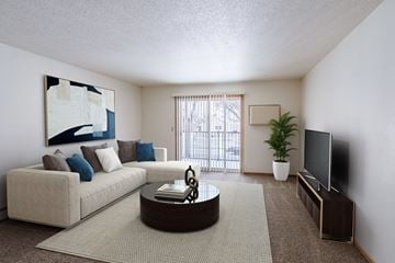 Fargo apartment for rent - a living room with a couch and a coffee table