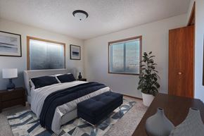 Fargo apartment for rent - a bedroom with a bed and two windows. Fargo, ND Somerset Apartments