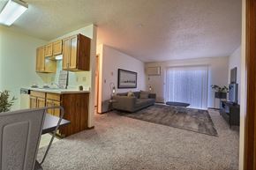 Fargo apartment for rent - a living room with a couch and a coffee table. Fargo, ND Southgate Apartments