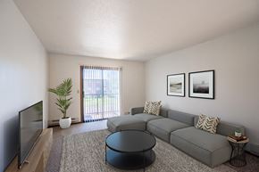 Fargo apartment for rent - a living room with a gray couch and a tv. Fargo, ND Southview Village Apartments