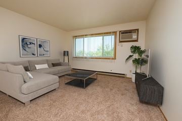 Fargo apartment for rent - a living room with a couch and a coffee table