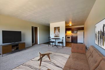 Fargo apartment for rent - the living room of an apartment with a couch and a tv