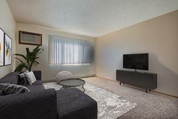 Fargo apartment for rent - a living room with a couch and a tv