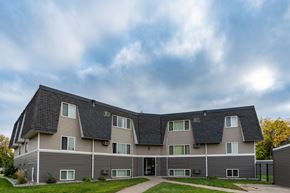Fargo apartment for rent - Fargo, ND Summerfield Apartments. A large apartment building with a roof shaped like a pyramid