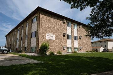 Fargo apartment for rent - a brick building with a sign on the side of it