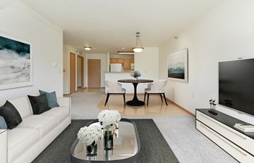 Fargo apartment for rent - a living room with a couch and a table and a television