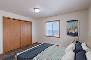 Fargo apartment for rent - the second bedroom has a queen sized bed and a closet. Fargo, ND Sunwood Apartments